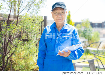 Senior in work clothes on the rooftop of an office building Senior in work clothes on the rooftop of an office building 141739471