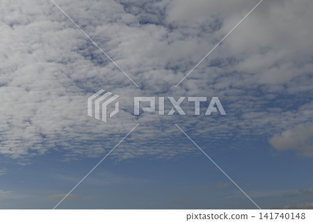 Cloudy sky with scattered cloud and blue horizon Cloudy sky with scattered cloud and blue horizon 141740148