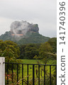 Sigiriya Rock, a World Heritage Site, visible through the mist. 141740396