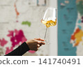 Close-Up of Wine Tasting Experience With Swirling Glass Against Map Background 141740491
