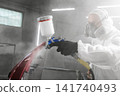 Car paint job by professional worker, car painting procedure in car service, body paint garage.  141740493
