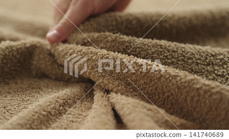 closeup shot of man touching green cotton terry towel closeup shot of man touching green cotton terry towel 141740689