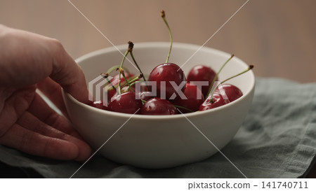 serving fresh cherries in white bowl serving fresh cherries in white bowl 141740711