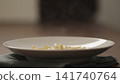 hot penne pasta in deep plate closeup 141740764