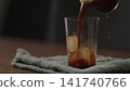 making ice latte at home closeup shot 141740766