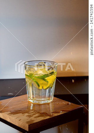 Backlit Glass of Refreshing Lime Drink Backlit Glass of Refreshing Lime Drink 141741594