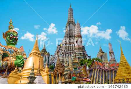 Colorful giant guardian statue with iconic temples and Grand Palace in Bangkok, Thailand. Colorful giant guardian statue with iconic temples and Grand Palace in Bangkok, Thailand. 141742485