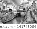 Canals and boats with historic buildings in Livorno, Italy 141743064