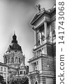 St. Stephen's Basilica Dome and Ornate Buildings Against Blue Sky 141743068