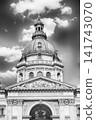 St. Stephen's Basilica Dome and Ornate Buildings Against Blue Sky 141743070