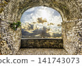 Ancient Stone Archway View to Dramatic Sunset Sky 141743073