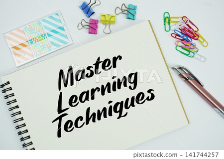 Master Learning Techniques text message written on notepad with stationery flat lay on white background Master Learning Techniques text message written on notepad with stationery flat lay on white background 141744257
