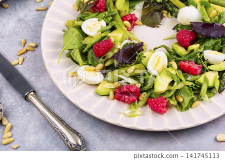 Fresh mixed greens salad with asparagus, avocado and raspberries Fresh mixed greens salad with asparagus, avocado and raspberries 141745113