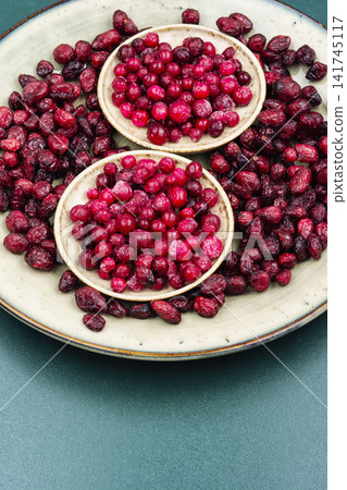 Red Cranberry Berries on Plate with Frozen and Dried Fruit Red Cranberry Berries on Plate with Frozen and Dried Fruit 141745117