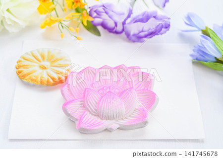 Sweets and colorful floral offerings for Buddhist ceremonies and memorial services. Sweets and colorful floral offerings for Buddhist ceremonies and memorial services. 141745678