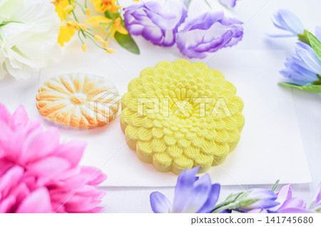 Sweets and colorful floral offerings for Buddhist ceremonies and memorial services. Sweets and colorful floral offerings for Buddhist ceremonies and memorial services. 141745680