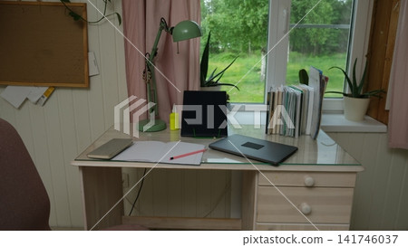 Remote workplace of accountant, bookkeeper. No people. Work place in a kitchen. Working from home. Business report, data entry for company tasks. Laptop, calculator and paperwork. Study, productivity Remote workplace of accountant, bookkeeper. No people. Work place in a kitchen. Working from home. Business report, data entry for company tasks. Laptop, calculator and paperwork. Study, productivity 141746037