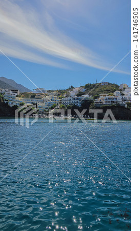 Scenic view of Bali resort village on Crete island Greece with white hotels on green hills over calm blue sea water bay for tropical Mediterranean vacation concept Scenic view of Bali resort village on Crete island Greece with white hotels on green hills over calm blue sea water bay for tropical Mediterranean vacation concept 141746505
