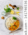 Indian chana masala dish with rice on plate 141746536