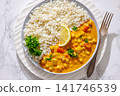 Indian chana masala dish with rice on plate 141746539