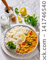 Creamy garbanzo bean curry with rice and lemon 141746540