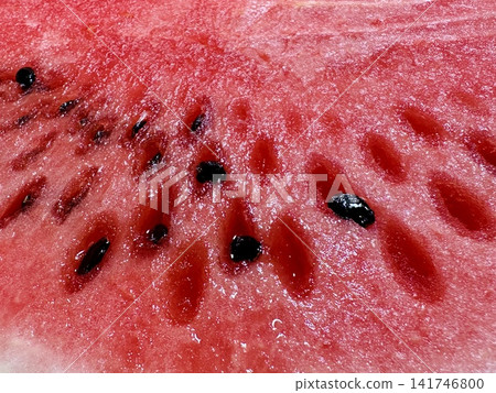 Close-up of a juicy watermelon cross-section | Summer fruit, red flesh, background material, texture Close-up of a juicy watermelon cross-section | Summer fruit, red flesh, background material, texture 141746800