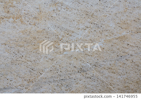 Aged beige wall surface with small irregularities, weathering marks and a natural abstract pattern. Aged beige wall surface with small irregularities, weathering marks and a natural abstract pattern. 141746955
