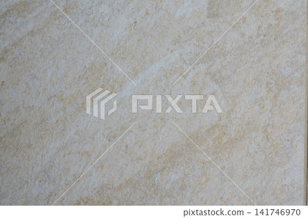 Close up of light beige tile with soft natural shades and an uneven fine grained surface texture. 141746970
