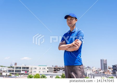 Blue sky and a smiling male truck driver Blue sky and a smiling male truck driver 141747045