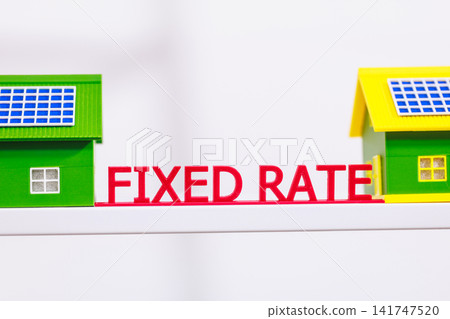 Toy houses with red fixed rate text, symbolizing mortgage rates, home loans, property finance, and real estate costs. Toy houses with red fixed rate text, symbolizing mortgage rates, home loans, property finance, and real estate costs. 141747520