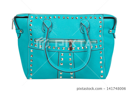 Turquoise teal leather women tote bag decorated with gold pyramid studs isolated on white background. Fashionable female purse front view Turquoise teal leather women tote bag decorated with gold pyramid studs isolated on white background. Fashionable female purse front view 141748006
