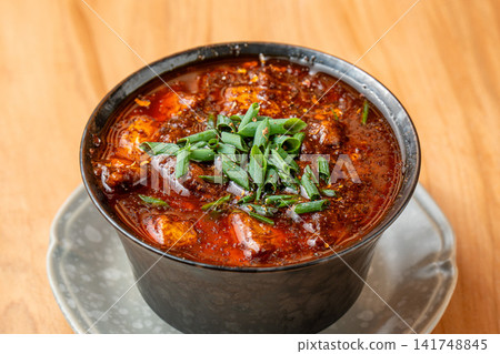 Deeply flavorful and rich beef tendon mapo tofu Deeply flavorful and rich beef tendon mapo tofu 141748845