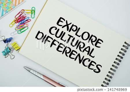 Explore Cultural Differences text message written on notepad with stationery flat lay on white background Explore Cultural Differences text message written on notepad with stationery flat lay on white background 141748969
