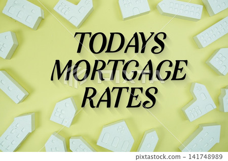 Todays Mortgage Rates text with house models on yellow background Todays Mortgage Rates text with house models on yellow background 141748989