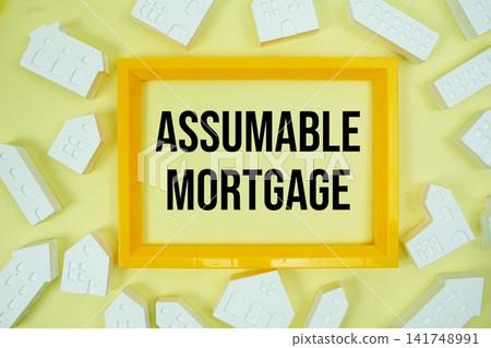 Assumable Mortgage text with house models on yellow background Assumable Mortgage text with house models on yellow background 141748991