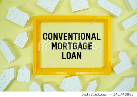 Conventional Mortgage Loan text with house models on yellow background Conventional Mortgage Loan text with house models on yellow background 141748992