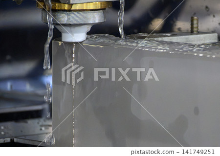 Close up operation of wire EDM machine cutting high thickness metal part Close up operation of wire EDM machine cutting high thickness metal part 141749251