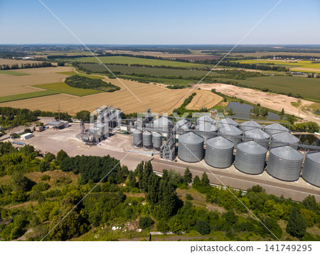 Panoramic Drone View of Industrial Silo Storage Infrastructure and Farmland Panoramic Drone View of Industrial Silo Storage Infrastructure and Farmland 141749295