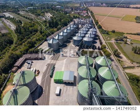 Elevated Drone View of Large Agricultural Grain Silo Plant and Farmland Elevated Drone View of Large Agricultural Grain Silo Plant and Farmland 141749302