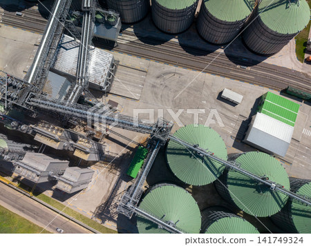 Top Down Aerial View of Industrial Grain Elevator and Rail Logistics System Top Down Aerial View of Industrial Grain Elevator and Rail Logistics System 141749324