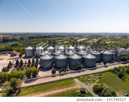Elevated Drone View of Metal Grain Silo Array in Agroindustrial Zone Elevated Drone View of Metal Grain Silo Array in Agroindustrial Zone 141749327
