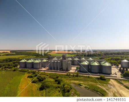 Wide Angle Drone View of Extensive Agroindustrial Grain Silo Plant Wide Angle Drone View of Extensive Agroindustrial Grain Silo Plant 141749331