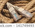 Patch cord of network cable on rope skein close up 141749493