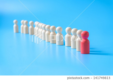 Wooden figure standing to the wooden group crowd. Concept of business leadership . Wooden figure standing to the wooden group crowd. Concept of business leadership . 141749813