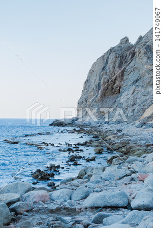 Natural pools along the Red Sea coast in Dahab, Egypt. Rocky shoreline under the Sinai mountains with clear blue water. Natural pools along the Red Sea coast in Dahab, Egypt. Rocky shoreline under the Sinai mountains with clear blue water. 141749967