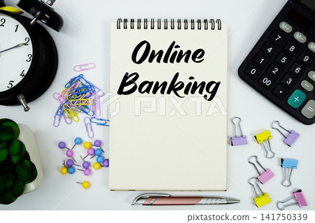 Online Banking text written on notepad with calculator and alarm clock Online Banking text written on notepad with calculator and alarm clock 141750339