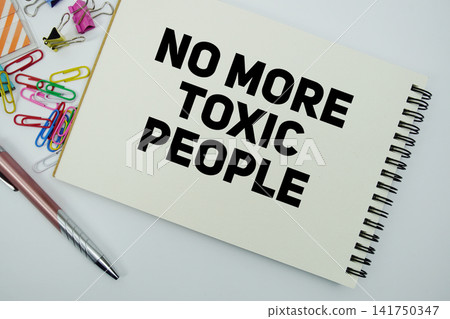 No More Toxic People text message written on notepad with stationery flat lay on white background 141750347