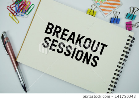 Breakout Sessions text message written on notepad with stationery flat lay on white background Breakout Sessions text message written on notepad with stationery flat lay on white background 141750348