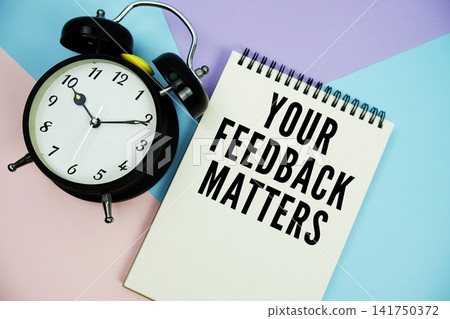 Your Feedback Matters text written on notepad with alarm clock flat lay on multicolor pastel background Your Feedback Matters text written on notepad with alarm clock flat lay on multicolor pastel background 141750372