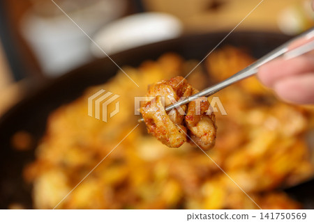 Spicy Korean Chicken Stir Fry Dakgalbi with Vegetables on Iron Pan Spicy Korean Chicken Stir Fry Dakgalbi with Vegetables on Iron Pan 141750569